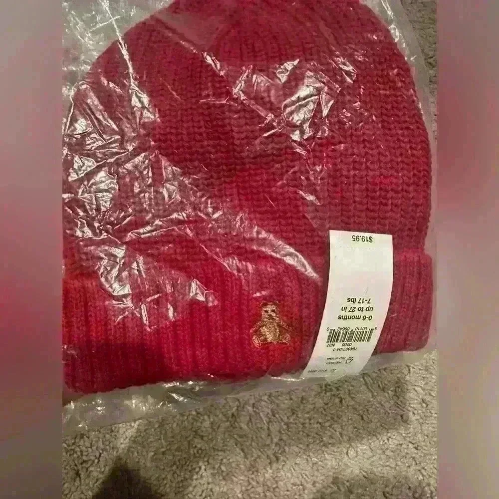 Brand new baby beanie in packaging.